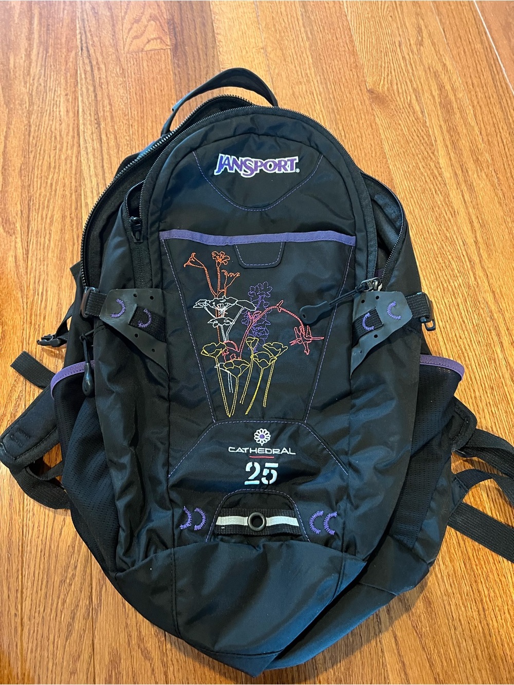 Jansport Black Backpack with Purple Accents and Floral Embroidery